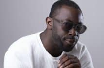 African American Man in Sunglasses Looking Suspiciously