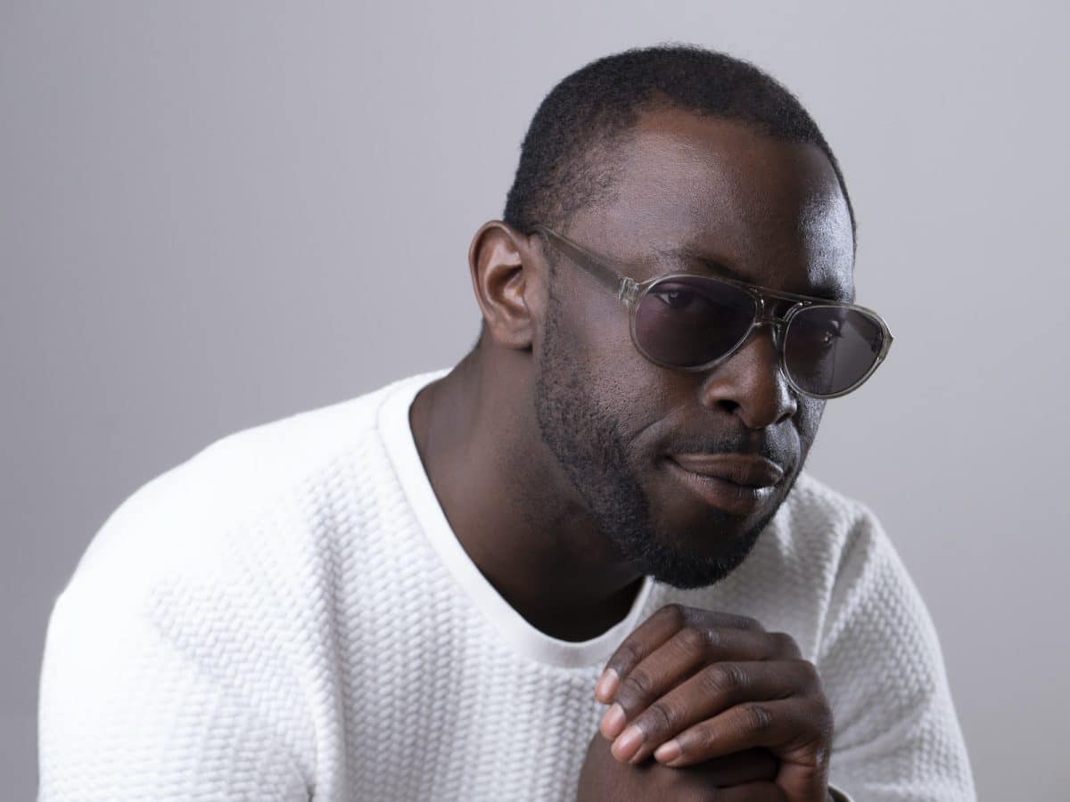 African American Man in Sunglasses Looking Suspiciously